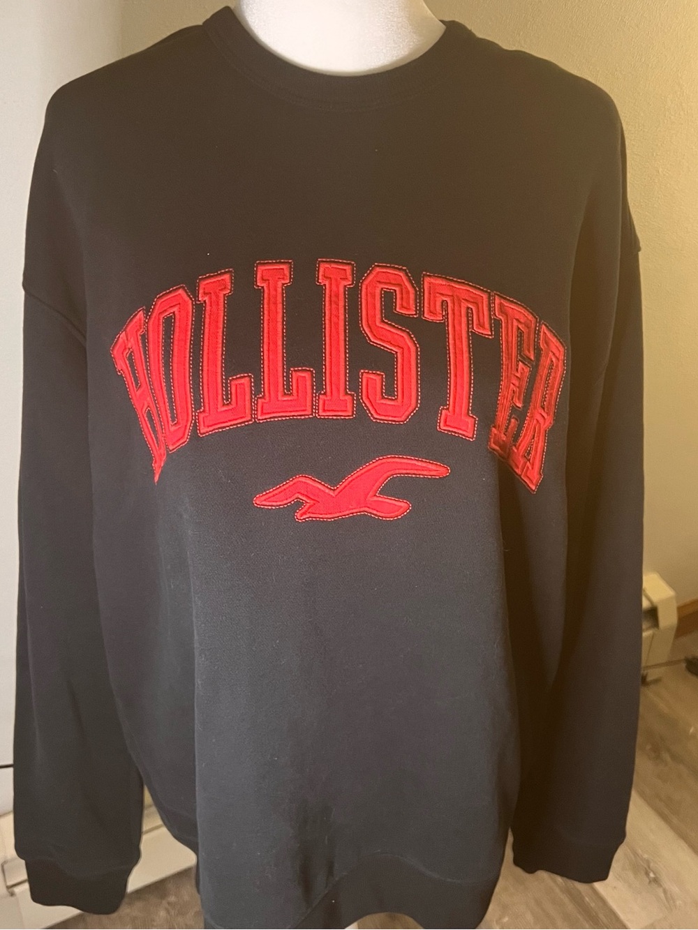 Hollister Black Crewneck Sweatshirt with Red Appliqué Logo